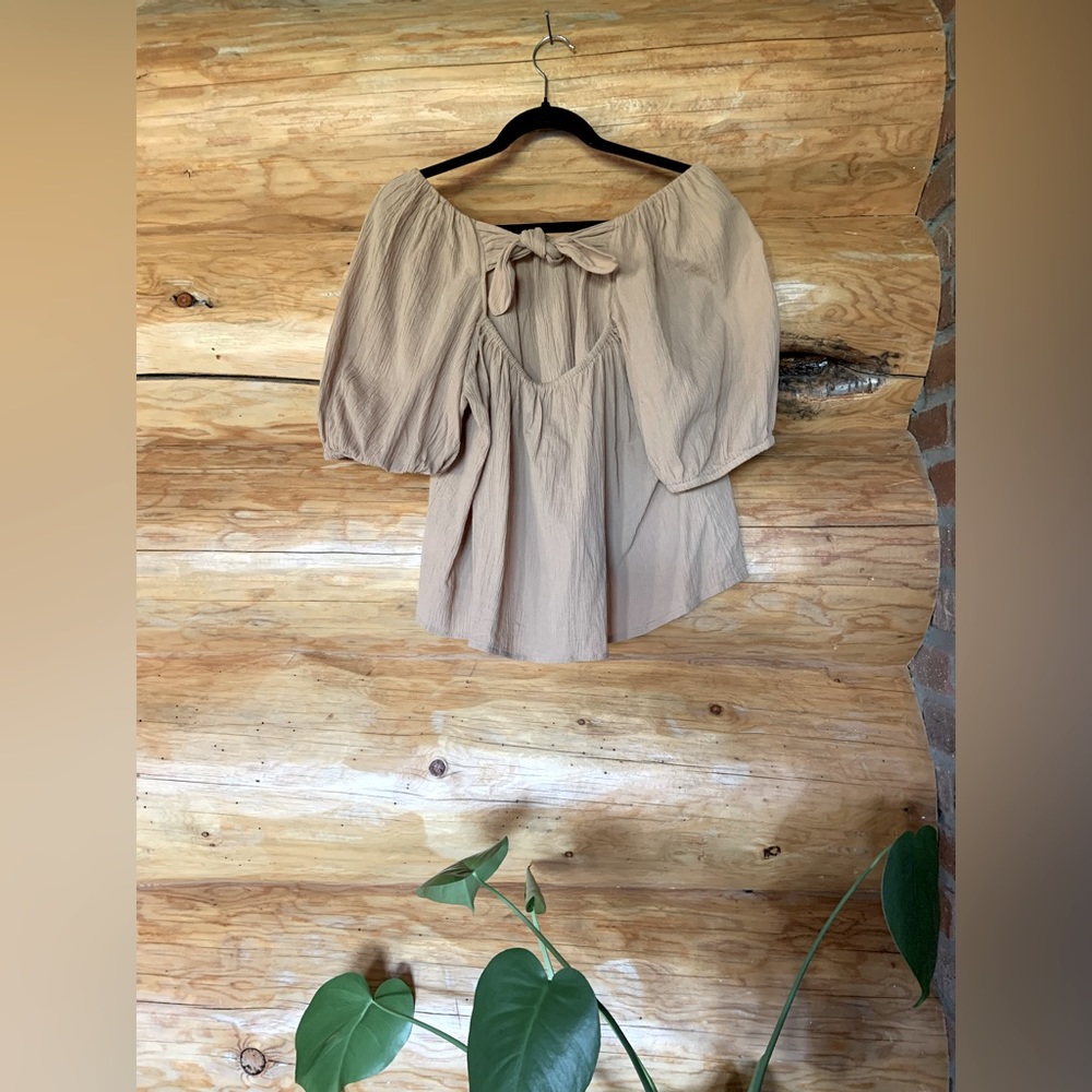 Blouse with peek-a-boo tie in back